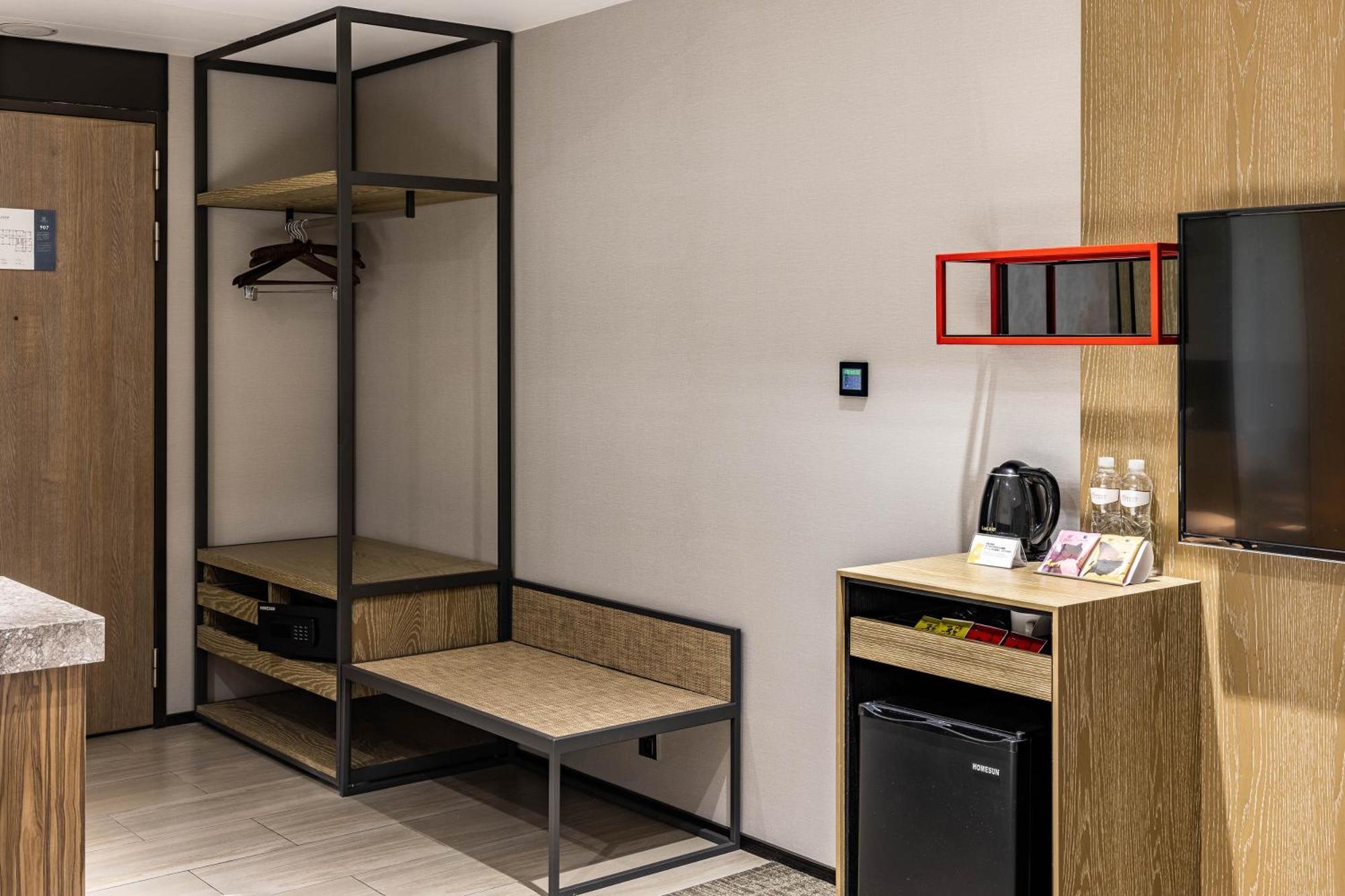 Hsin Hotel Цзяї Номер фото A room at the hotel