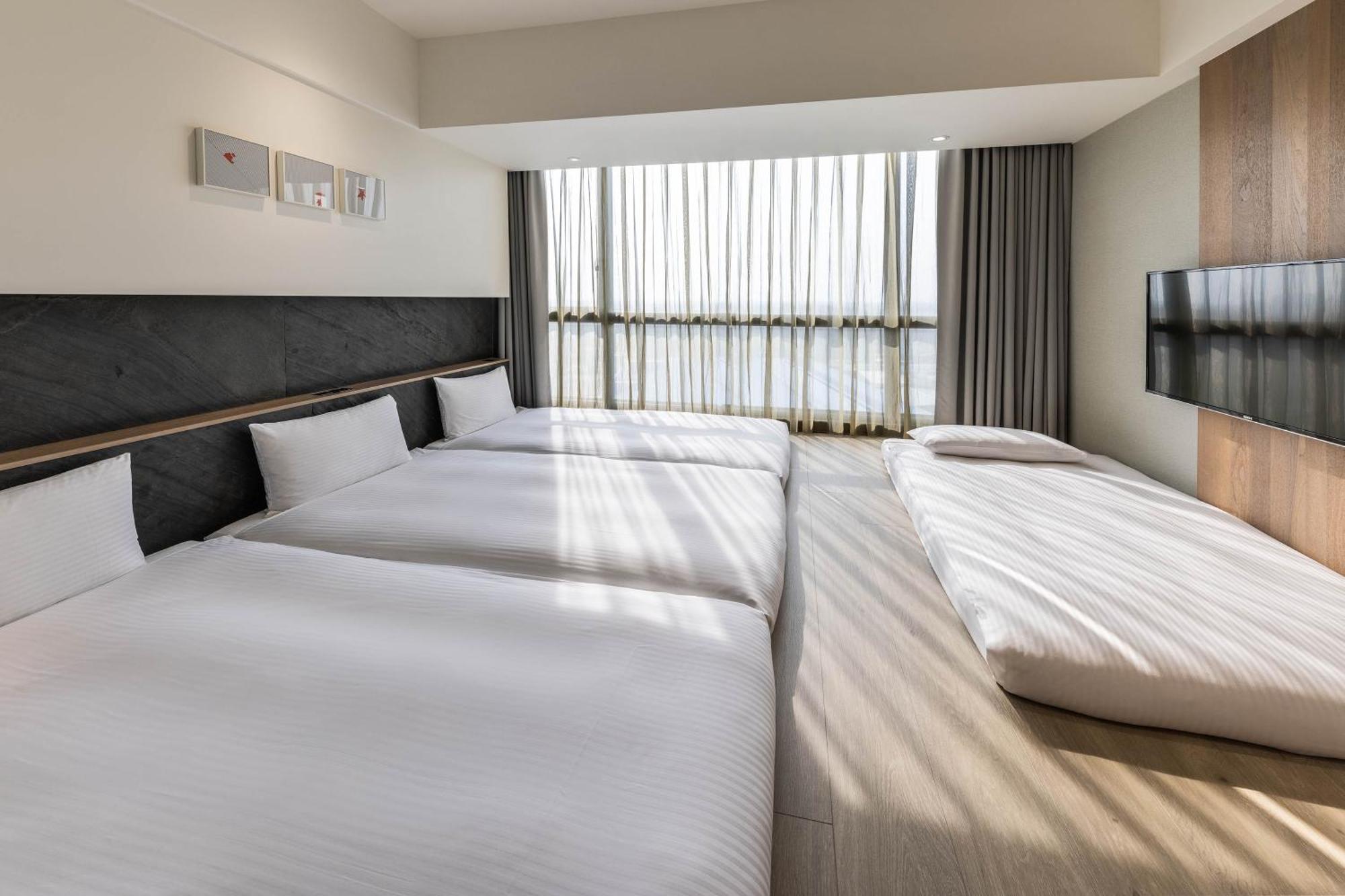 Hsin Hotel Цзяї Номер фото A room at the hotel